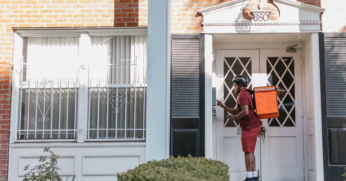 locksmith unlocking front door — First Locksmiths